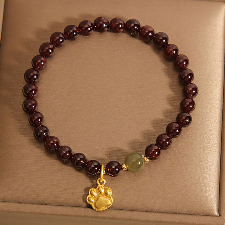 Pulsera purificadora de cuentas de jade hetian con granate y pata de gato de Buddha Stones
