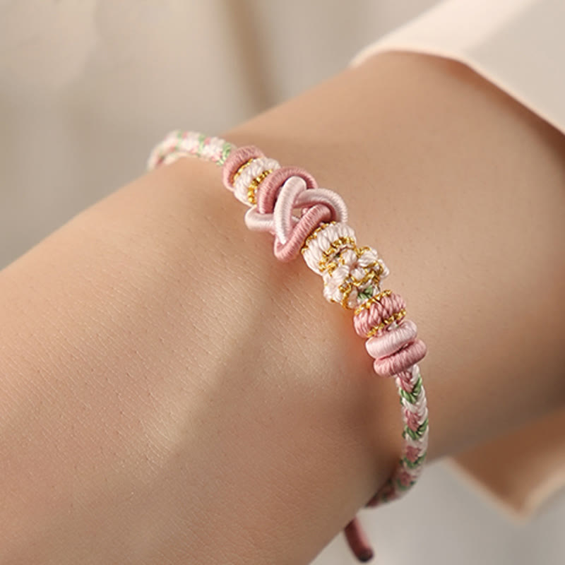Pulsera ajustable de cuerda colorida con nudo de paz de flor de durazno hecha a mano con Buddha Stones