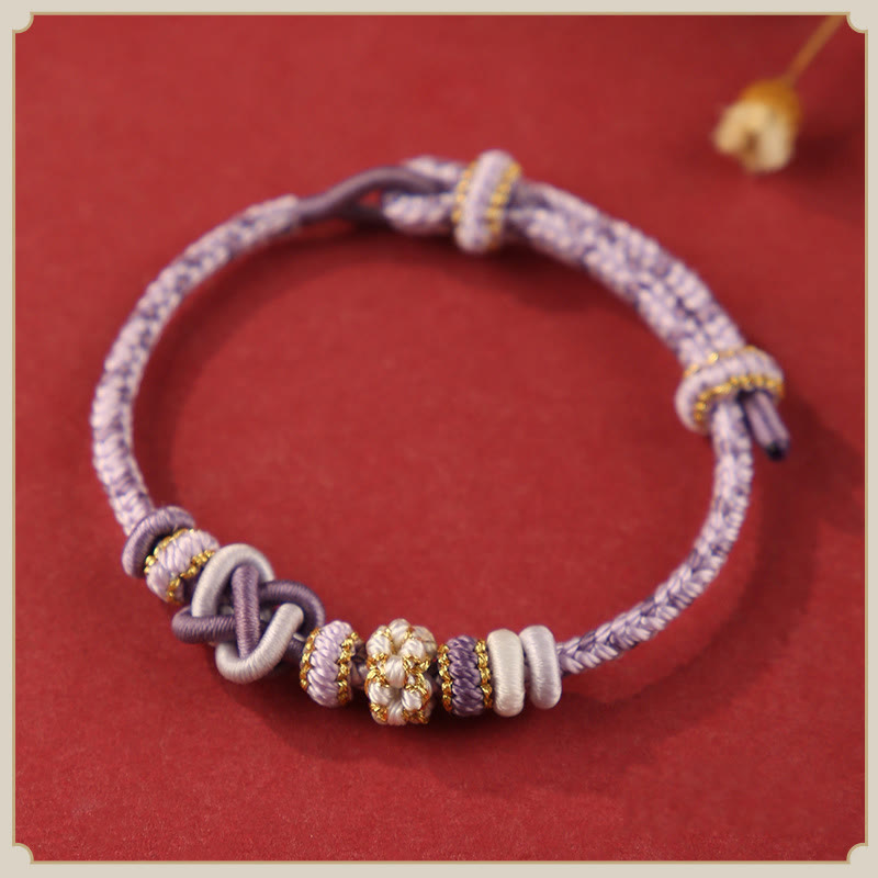 Pulsera ajustable de cuerda colorida con nudo de paz de flor de durazno hecha a mano con Buddha Stones