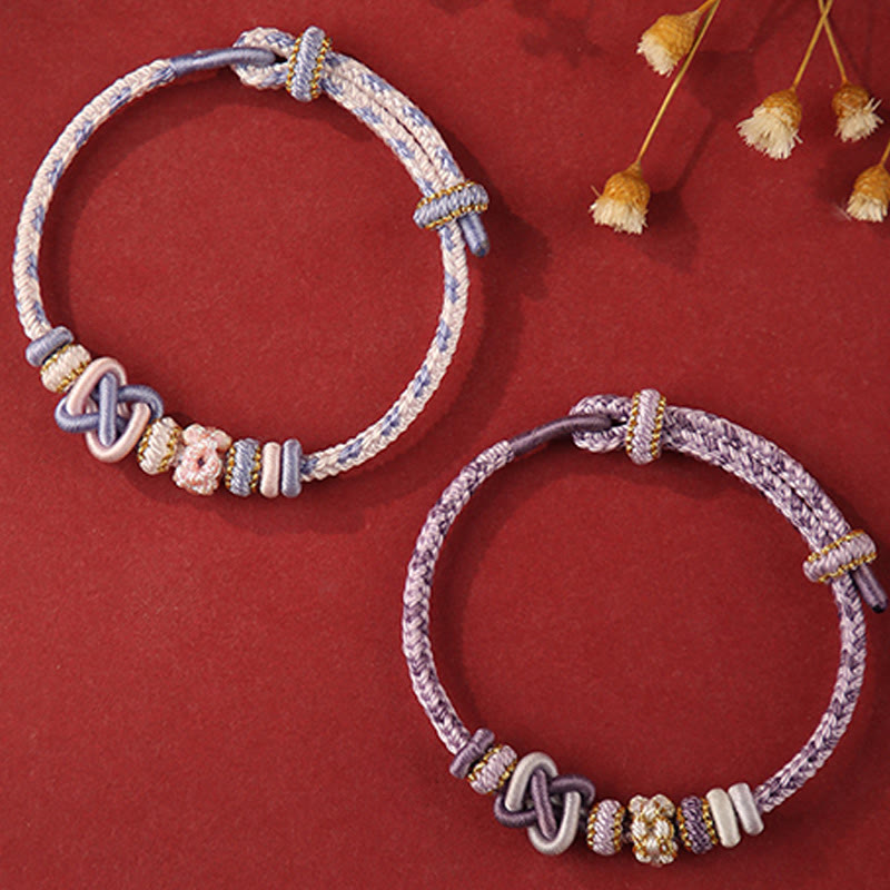 Pulsera ajustable de cuerda colorida con nudo de paz de flor de durazno hecha a mano con Buddha Stones