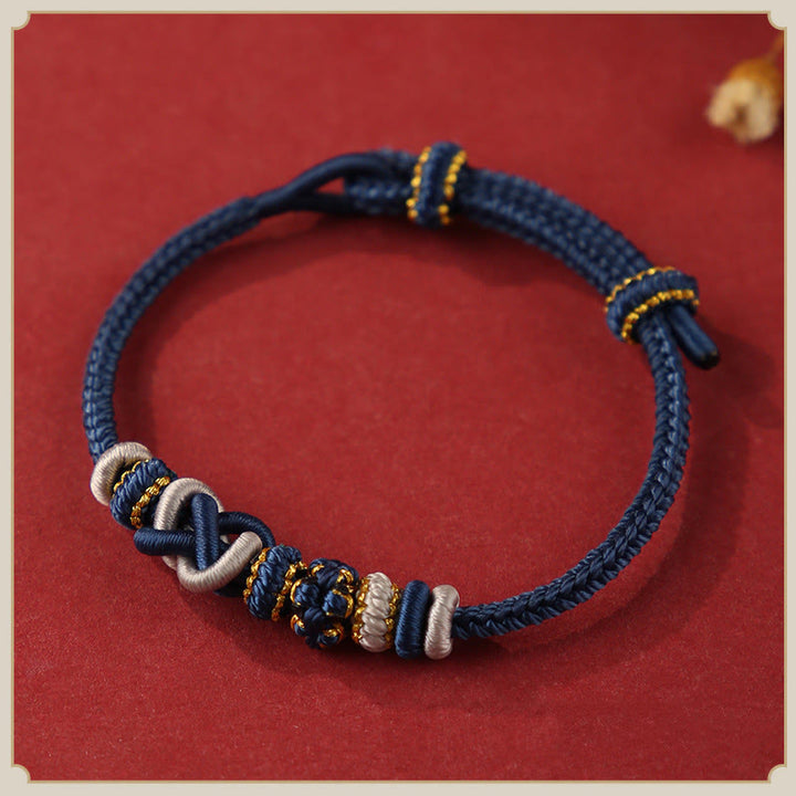 Pulsera ajustable de cuerda colorida con nudo de paz de flor de durazno hecha a mano con Buddha Stones