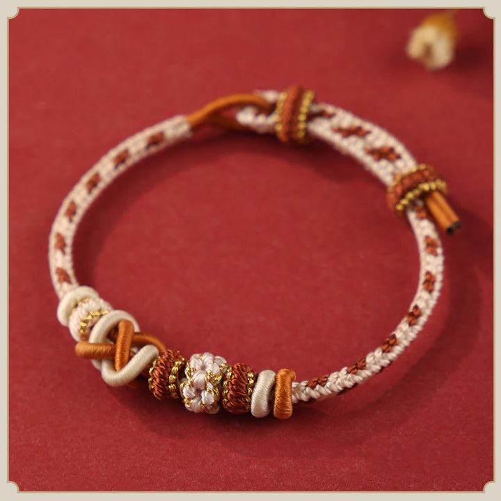 Pulsera ajustable de cuerda colorida con nudo de paz de flor de durazno hecha a mano con Buddha Stones