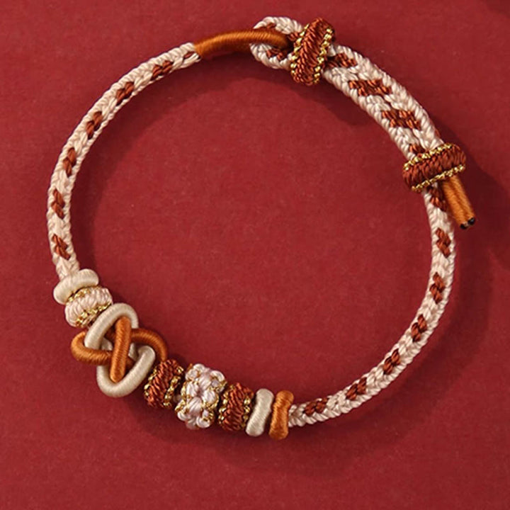 Pulsera ajustable de cuerda colorida con nudo de paz de flor de durazno hecha a mano con Buddha Stones