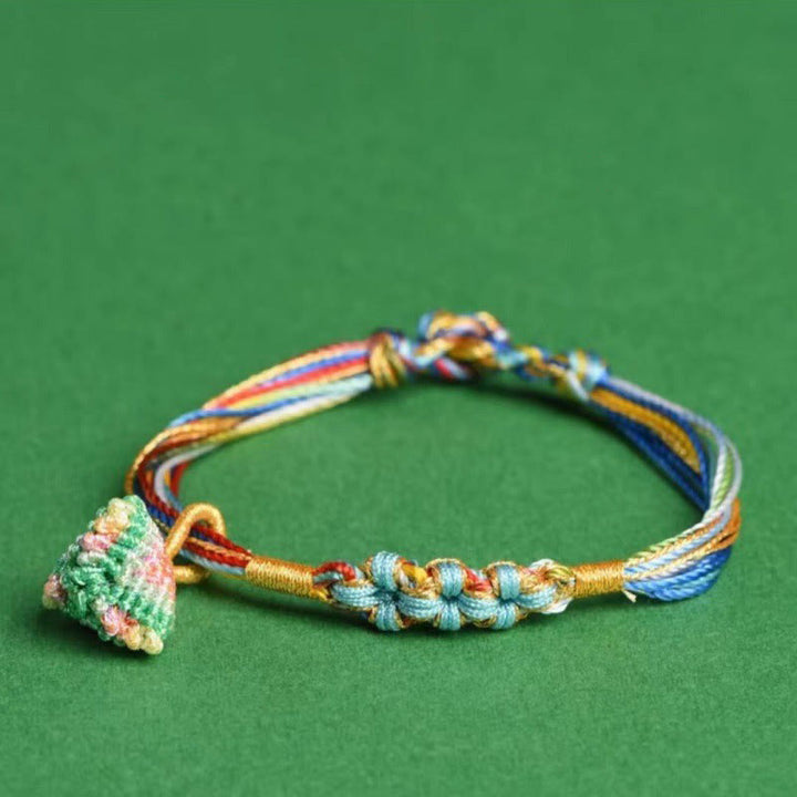 Pulsera trenzada zongzi con nudo de flor de durazno y cuerda colorida de Buddha Stones