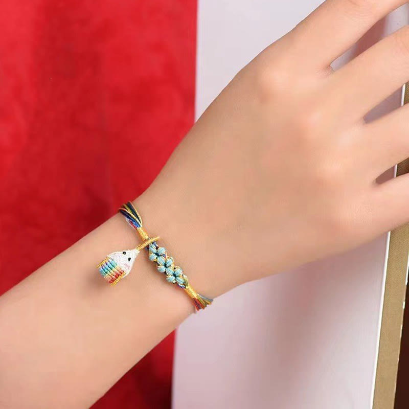 Pulsera trenzada zongzi con nudo de flor de durazno y cuerda colorida de Buddha Stones