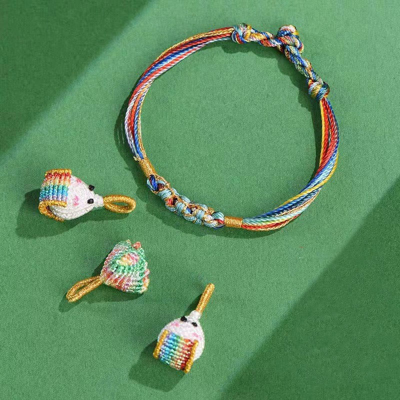 Pulsera trenzada zongzi con nudo de flor de durazno y cuerda colorida de Buddha Stones