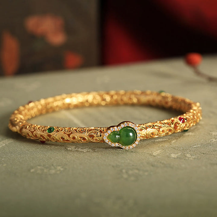 Pulsera de la suerte con calabaza, nubes auspiciosas y Buddha Stones cian bañado en cobre y oro.