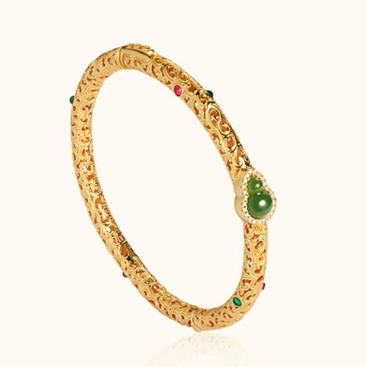 Pulsera de la suerte con calabaza, nubes auspiciosas y Buddha Stones cian bañado en cobre y oro.