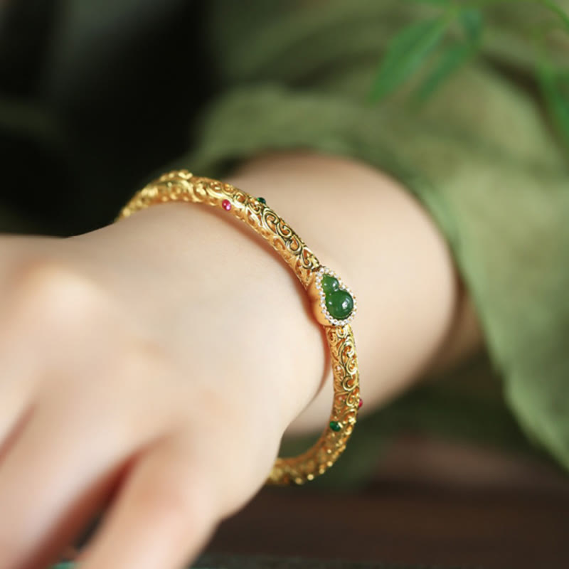 Pulsera de la suerte con calabaza, nubes auspiciosas y Buddha Stones cian bañado en cobre y oro.