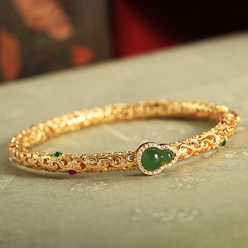 Pulsera de la suerte con calabaza, nubes auspiciosas y Buddha Stones cian bañado en cobre y oro.