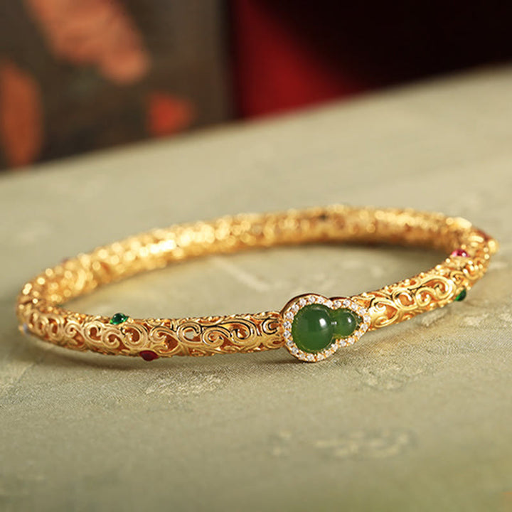 Pulsera de la suerte con calabaza, nubes auspiciosas y Buddha Stones cian bañado en cobre y oro.