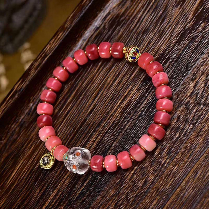 Pulsera de la suerte con Buddha Stones, hueso de camello tibetano, cobre y ágata roja