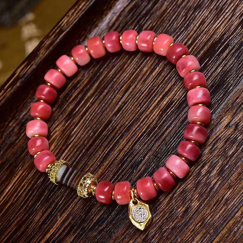 Pulsera de la suerte con Buddha Stones, hueso de camello tibetano, cobre y ágata roja