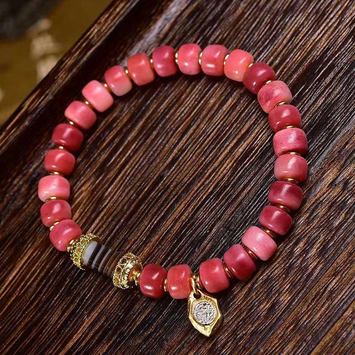 Pulsera de la suerte con Buddha Stones, hueso de camello tibetano, cobre y ágata roja