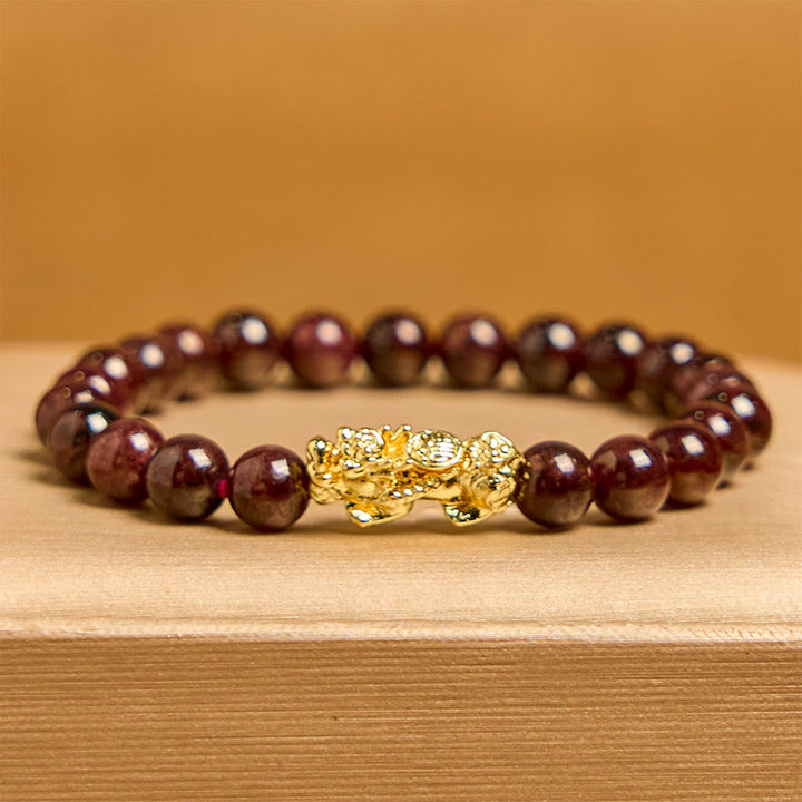 Pulsera de protección PiXiu con cuentas de granate natural y Buddha Stones