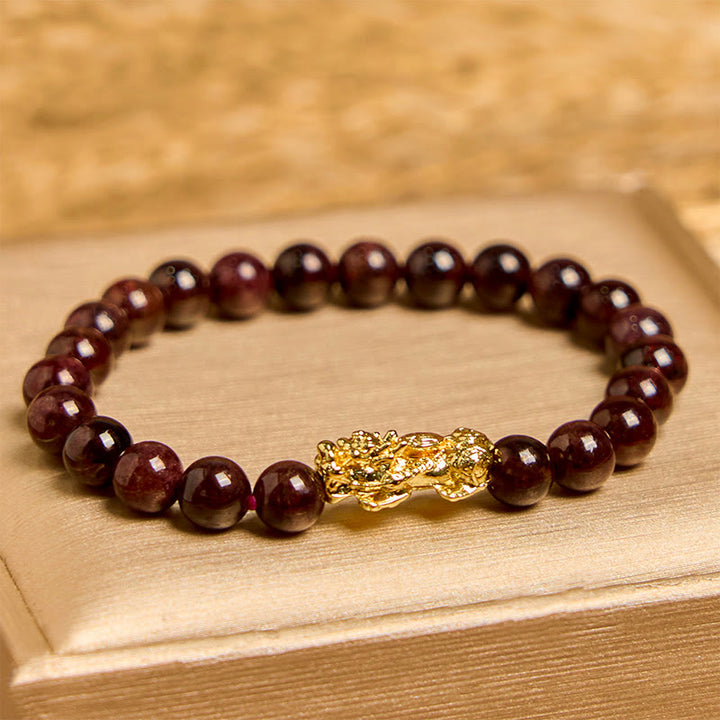 Pulsera de protección PiXiu con cuentas de granate natural y Buddha Stones
