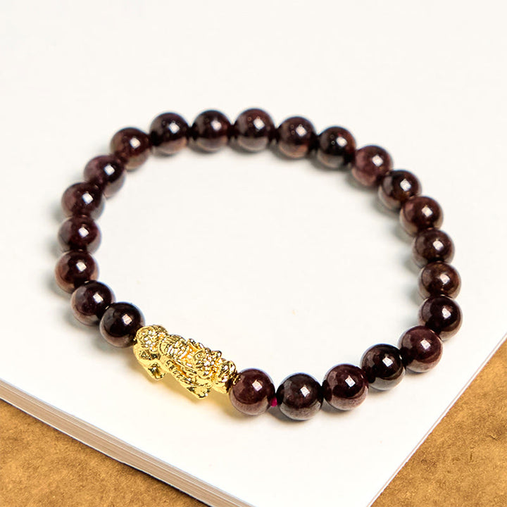 Pulsera de protección PiXiu con cuentas de granate natural y Buddha Stones