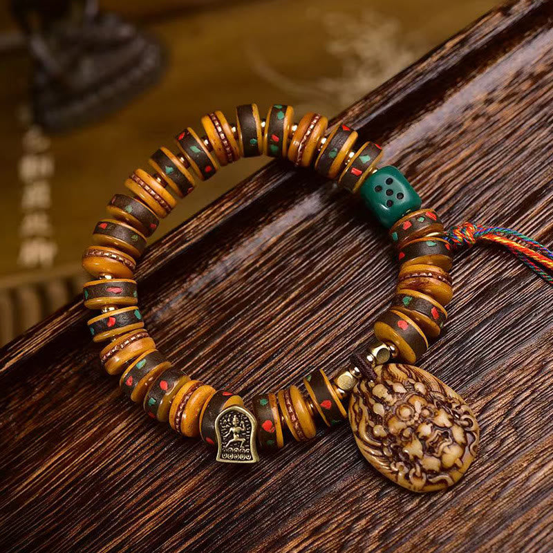 Pulsera de protección con borlas de hueso de camello tibetano y Buddha Stones