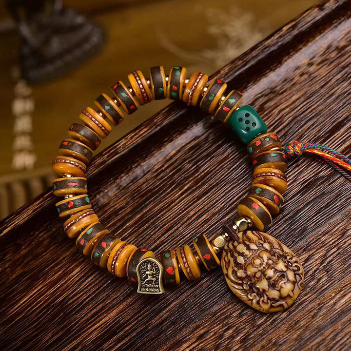 Pulsera de protección con borlas de hueso de camello tibetano y Buddha Stones