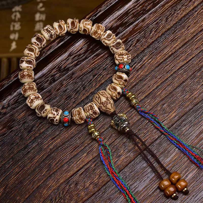 Pulsera de borlas protectoras talladas con garuda de hueso de camello tibetano y Buddha Stones