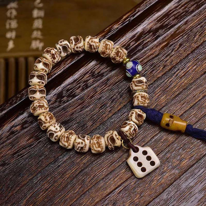 Pulsera de borlas protectoras talladas con garuda de hueso de camello tibetano y Buddha Stones