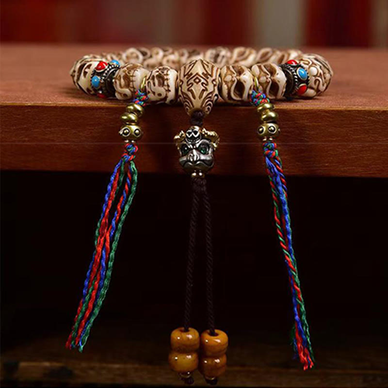 Pulsera de borlas protectoras talladas con garuda de hueso de camello tibetano y Buddha Stones
