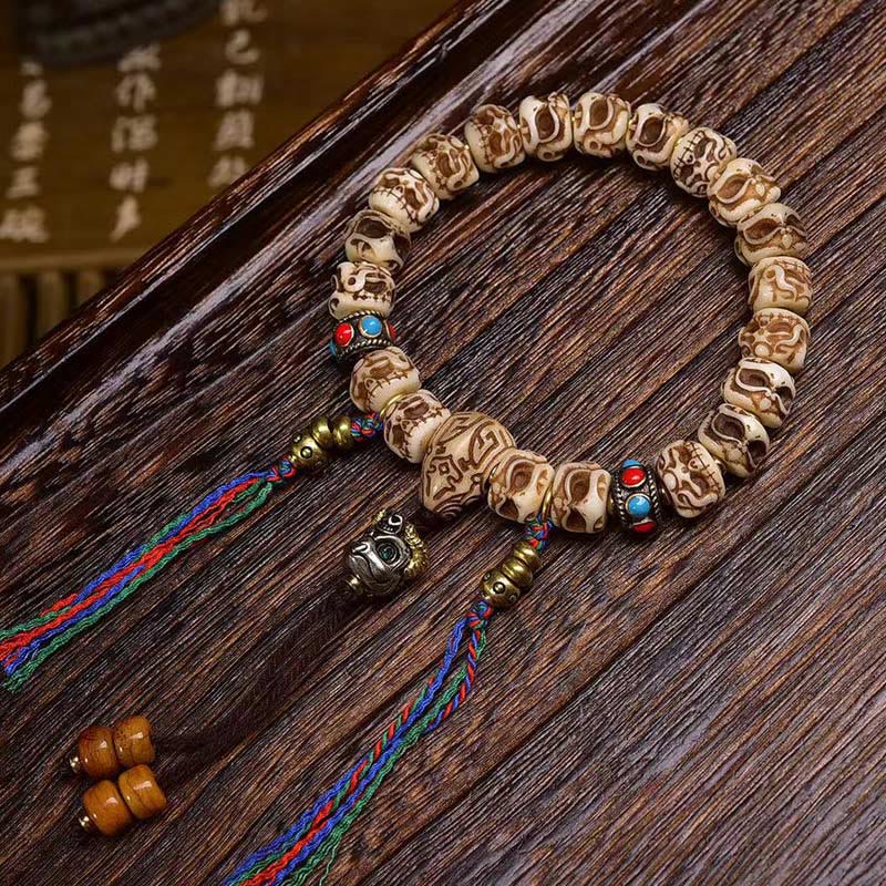Pulsera de borlas protectoras talladas con garuda de hueso de camello tibetano y Buddha Stones
