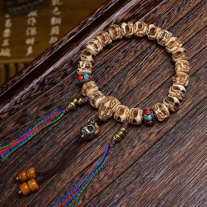 Pulsera de borlas protectoras talladas con garuda de hueso de camello tibetano y Buddha Stones