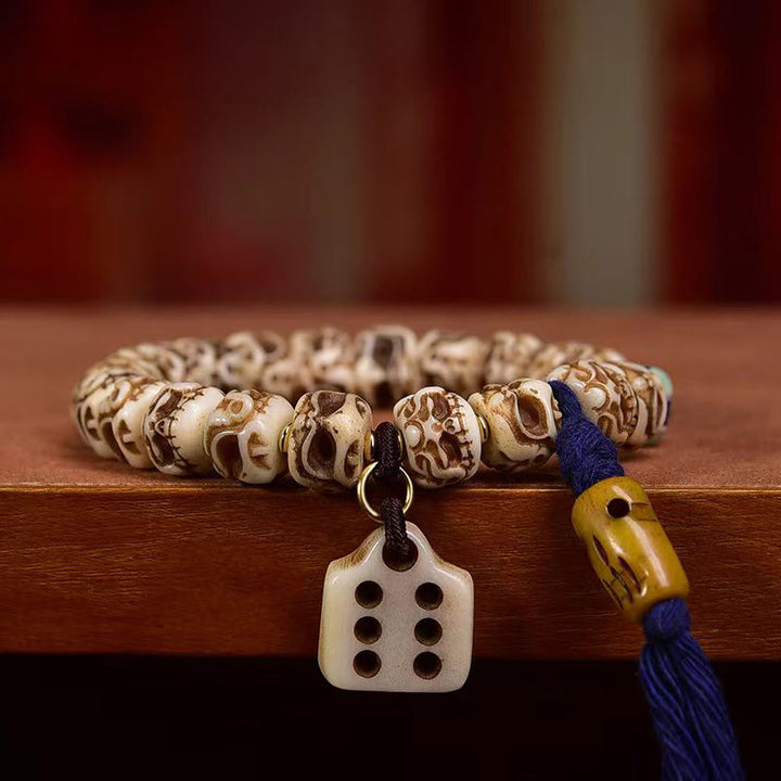 Pulsera de borlas protectoras talladas con garuda de hueso de camello tibetano y Buddha Stones