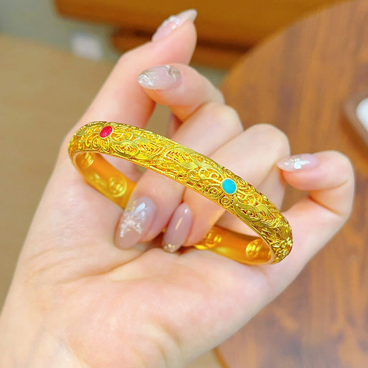 Pulsera de la suerte con Buddha Stones, flores y hojas bañadas en oro y cobre