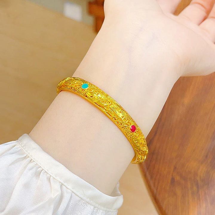 Pulsera de la suerte con Buddha Stones, flores y hojas bañadas en oro y cobre