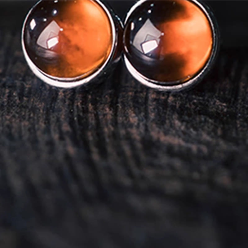 Pendientes de protección con granate y Buddha Stones en plata de ley 925