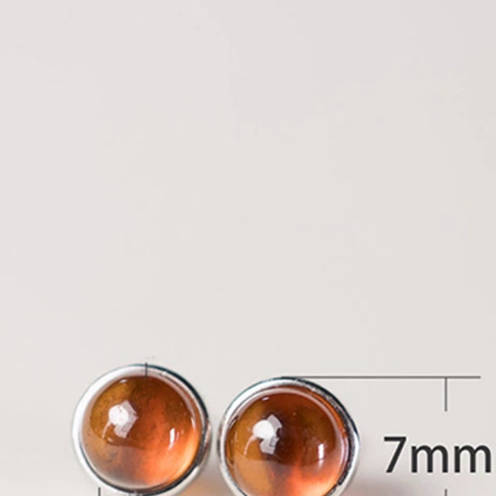 Pendientes de protección con granate y Buddha Stones en plata de ley 925