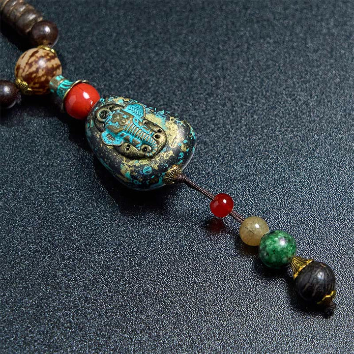 Collar con colgante de cabeza de elefante con cuentas Dzi de madera de wengué tibetana hechas a mano con Buddha Stones