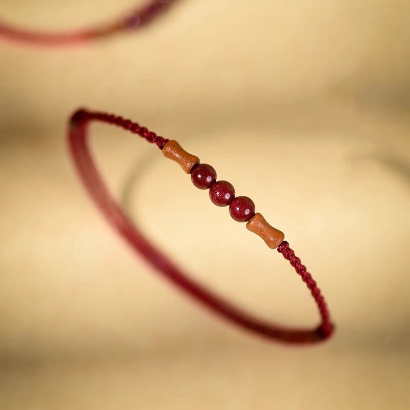 Pulsera de hilo bendecido de madera de melocotón con cuentas de cinabrio y Buddha Stones