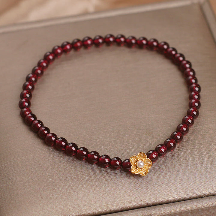 Pulsera de granate natural de 4 mm con Buddha Stones y flor de la pasión