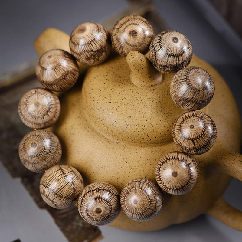 Pulsera protectora de cuentas de madera de gnetum con Buddha Stones - image 2