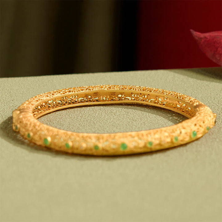 Pulsera de la riqueza con diseño de filigrana hueca y Buddha Stones bañadas en cobre y oro