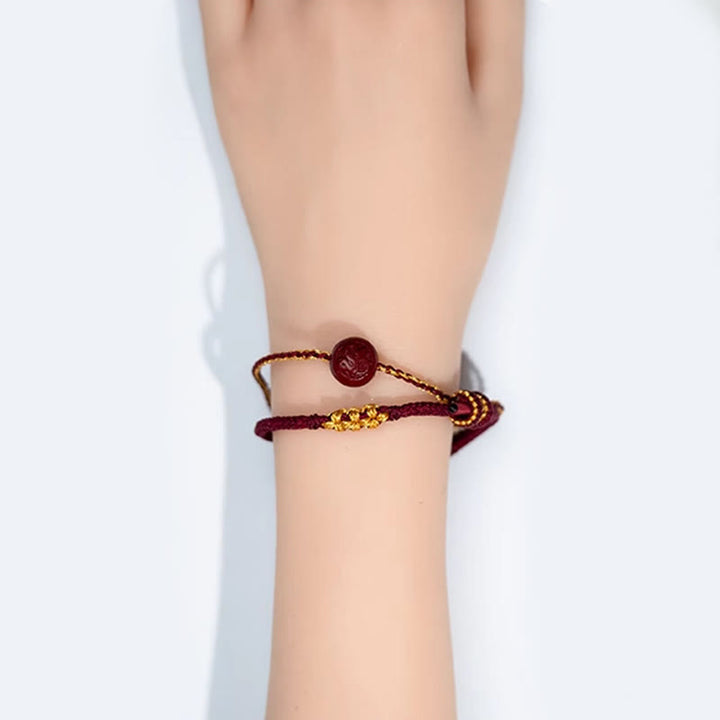 Pulsera trenzada de ocho hilos con cuentas de cinabrio y nudo de flor de durazno con Buddha Stones - image 5
