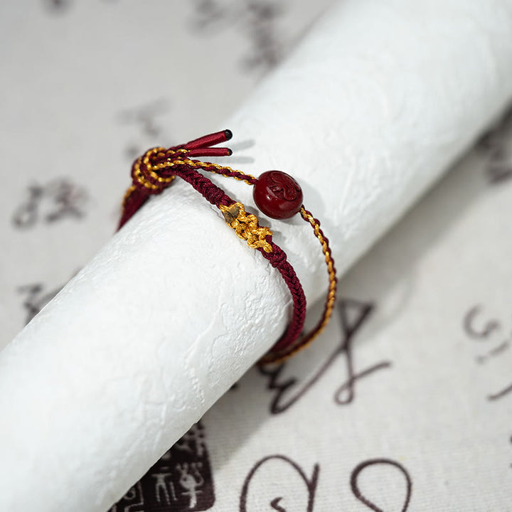 Pulsera trenzada de ocho hilos con cuentas de cinabrio y nudo de flor de durazno con Buddha Stones - image 4