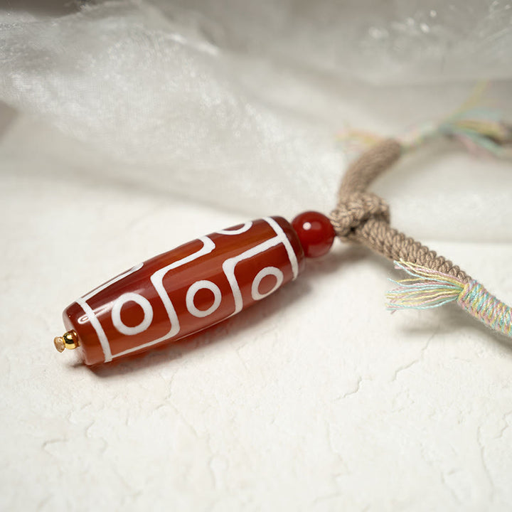 Pulsera de cuerda de energía con cuentas Dzi de nueve ojos de ágata roja natural de Buddha Stones - image 5