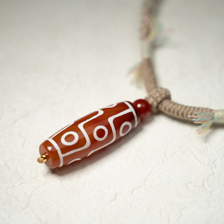 Pulsera de cuerda de energía con cuentas Dzi de nueve ojos de ágata roja natural de Buddha Stones - image 4