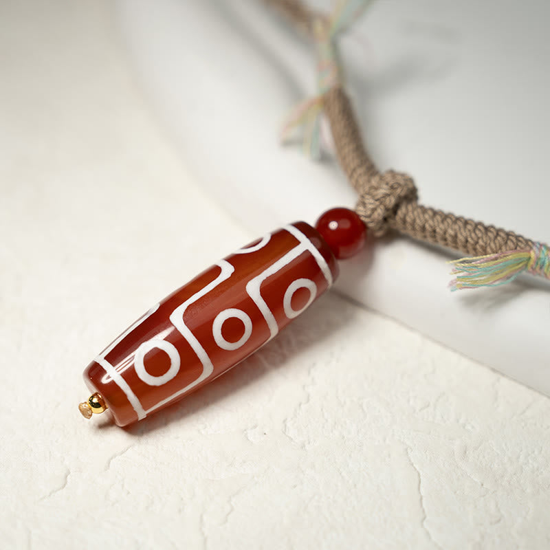 Pulsera de cuerda de energía con cuentas Dzi de nueve ojos de ágata roja natural de Buddha Stones - image 9