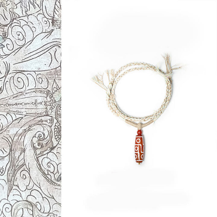 Pulsera de cuerda de energía con cuentas Dzi de nueve ojos de ágata roja natural de Buddha Stones - Cuenta Dzi de ágata roja de nueve ojos (circunferencia de la muñeca: 15-22 cm) - image 1