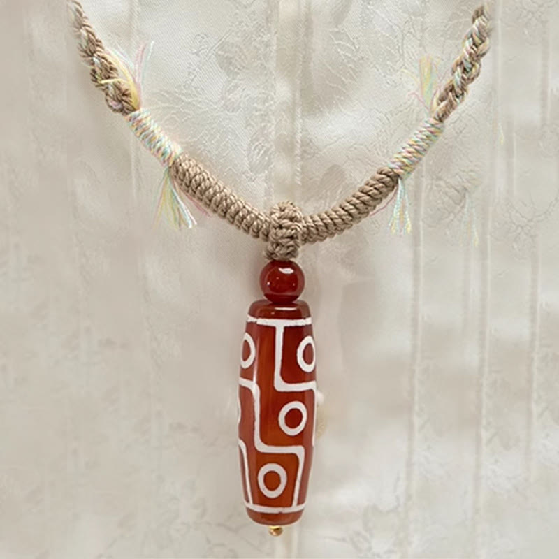 Pulsera de cuerda de energía con cuentas Dzi de nueve ojos de ágata roja natural de Buddha Stones - image 3