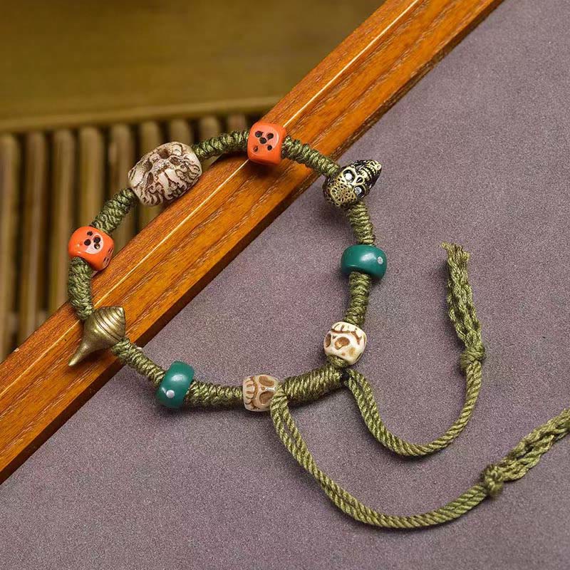 Pulsera de cuerda hecha a mano con dados y diseño de dragón tibetano de Buddha Stones - image 1