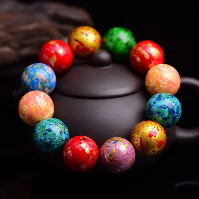 Pulsera protectora de cuentas de sándalo con laca multicolor y Buddha Stones - image 1