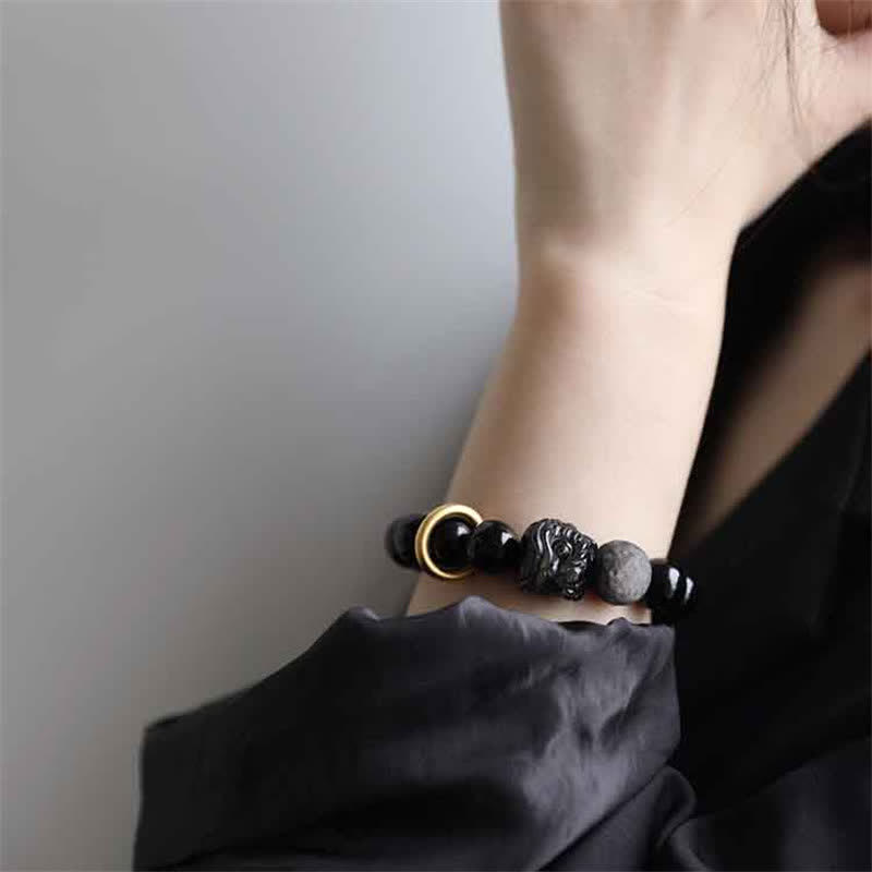 Pulsera de fuerza de león de obsidiana con brillo plateado de obsidiana negra