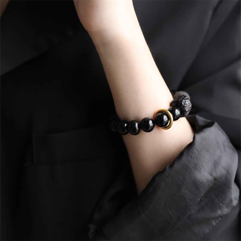 Pulsera de fuerza de león de obsidiana con brillo plateado de obsidiana negra