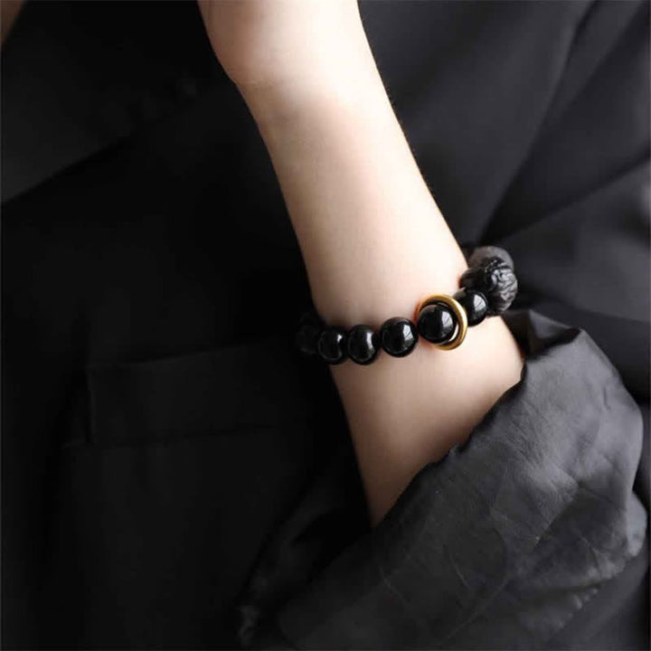 Pulsera de fuerza de león de obsidiana con brillo plateado de obsidiana negra